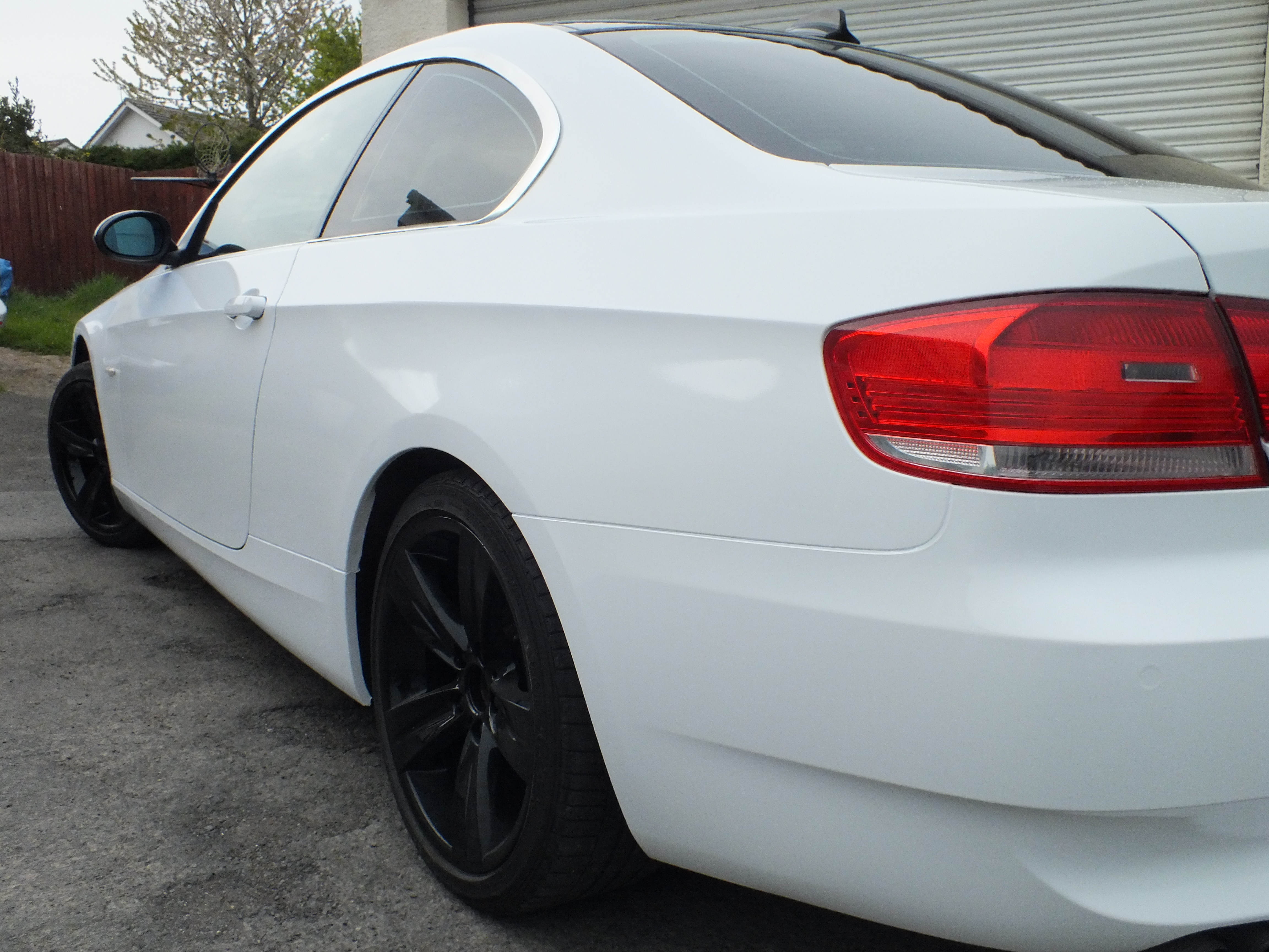 BMW 3 Series saloon in for window tinting and full vehicle wrap. From Graphite grey to white