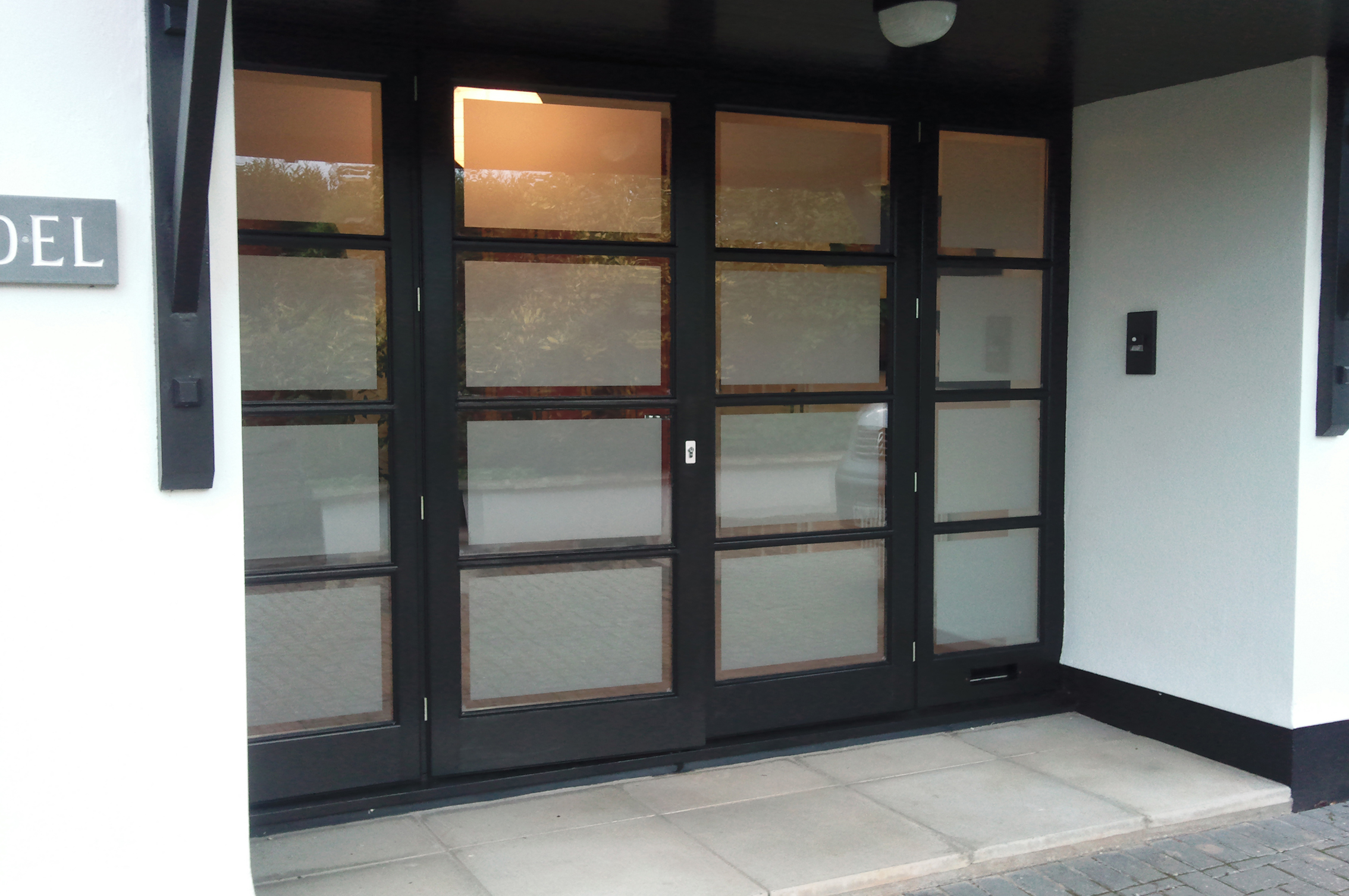 Frosted window film application to doors in Tiverton Devon Tinting Express Ltd