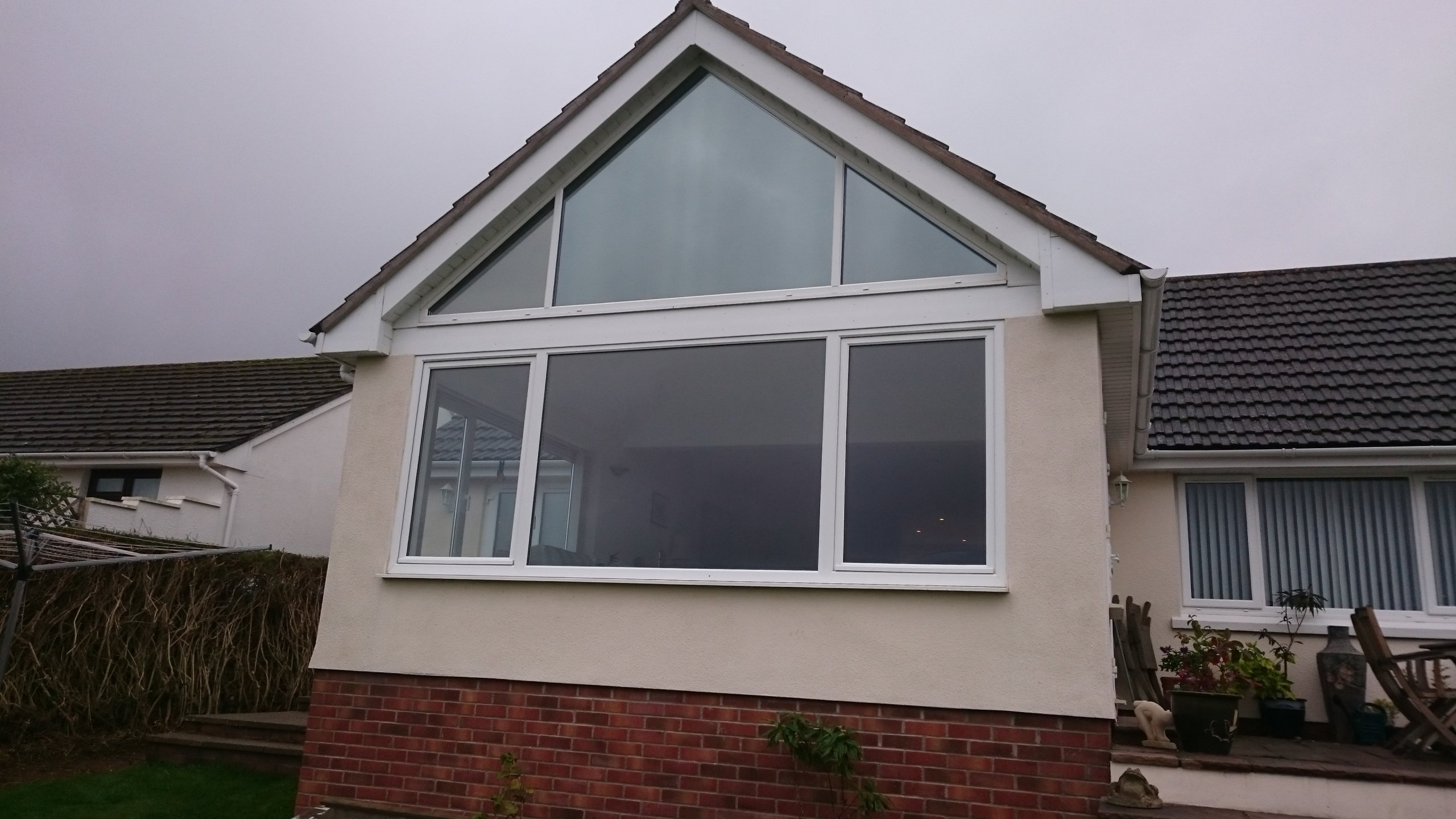 Final finished look from the outside. Gable end window Dual 30 reflective solar window film. Tinting Express Barnstaple