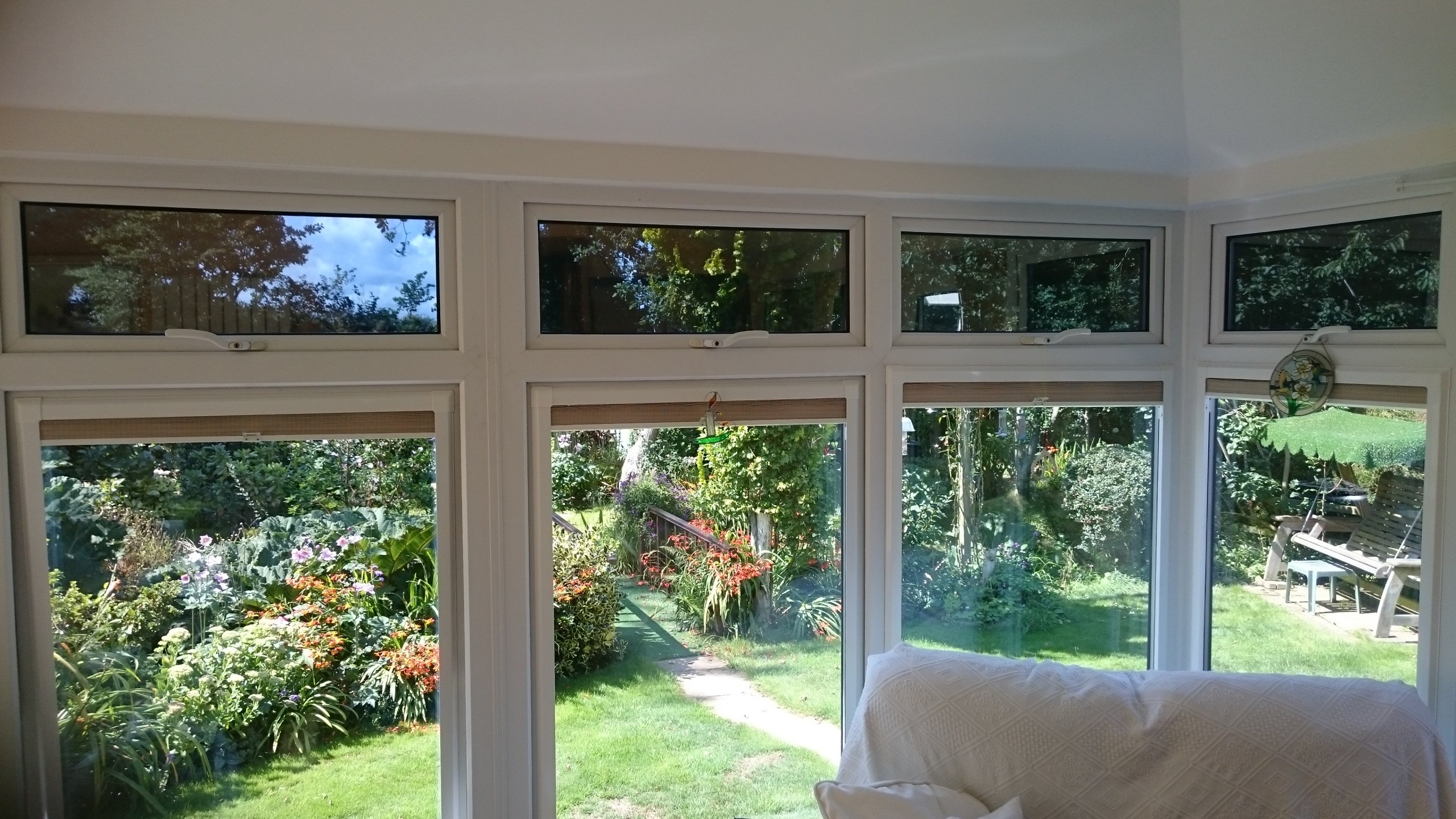 Opening vent windows in a conservatory fitted with Dual 15 solar window film to help reduce glare. Yelland Barnstaple by Tinting Express
