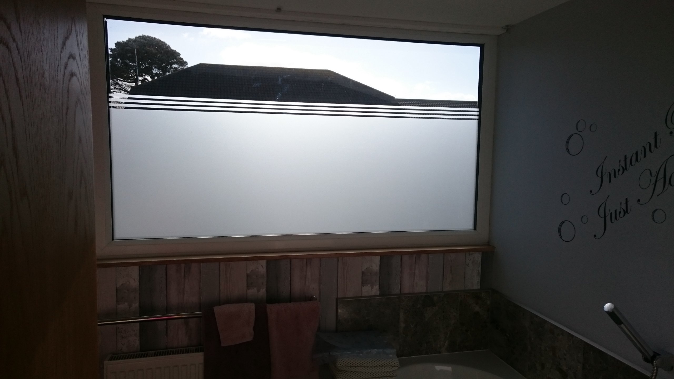 Frost film application to a bathroom window in Northam Bideford North Devon by Tinting Express Barnstaple
