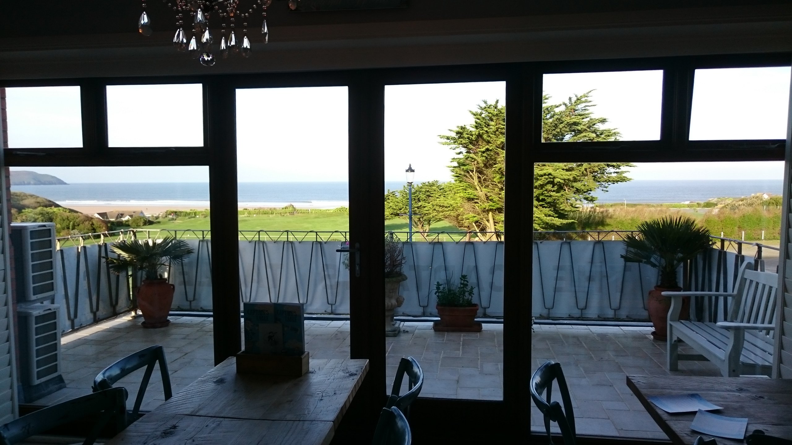 Completed door and window area of this dining area, helping to reduce the glare by 70% from the evening sunset. Tinting Express