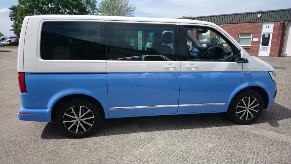 Two toned VW Transporter wrap. Blue added to a white Caravelle to create the two tone effect. 3M Smokey Blue wrap vinyl. Tinting Express Barnstaple