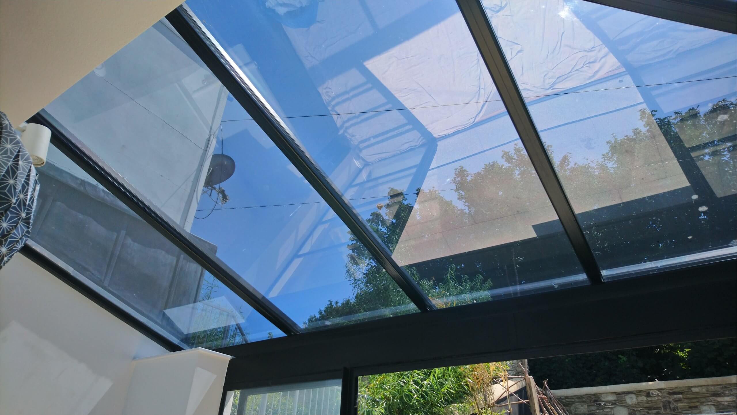 Glass extension to the kitchen. Solar window film application to the roof glass. Dual 15V film fitted. Blue tinted appearance. Tinting Express Barnstaple