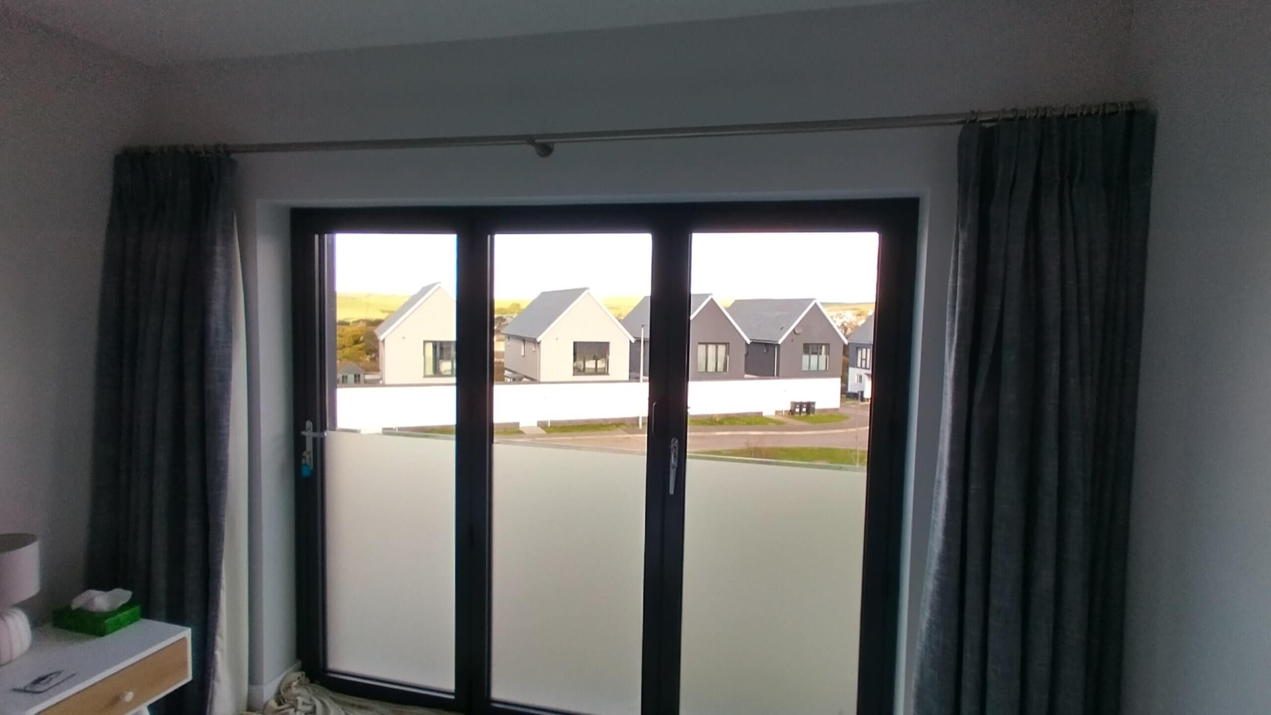 Application of a frosted window film to bifold doors to create privacy in the bedroom. Tinting Express Ltd